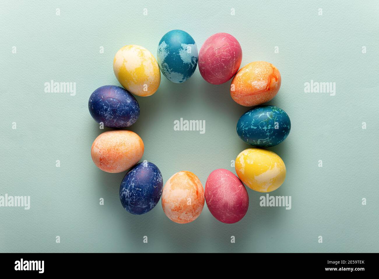 Easter eggs in minimal style on blue background. Easter concept. Flat layout Stock Photo