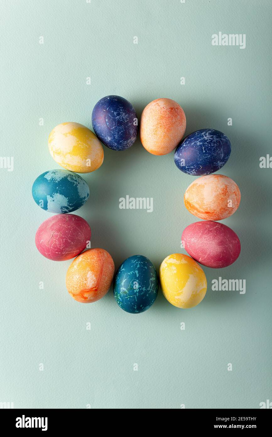 Easter eggs in minimal style on blue background. Easter concept. Flat layout Stock Photo