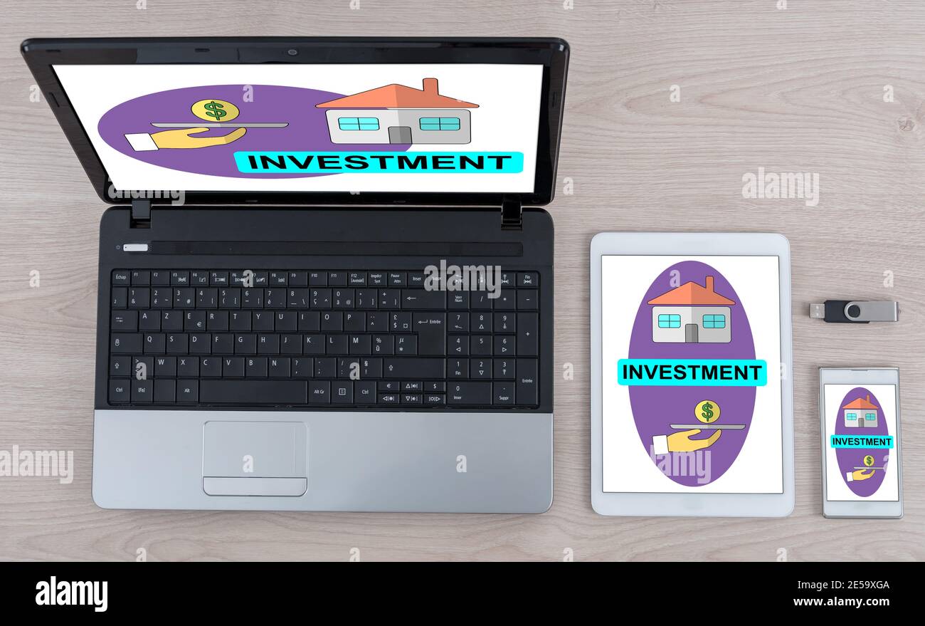 Investment concept shown on different information technology devices Stock Photo