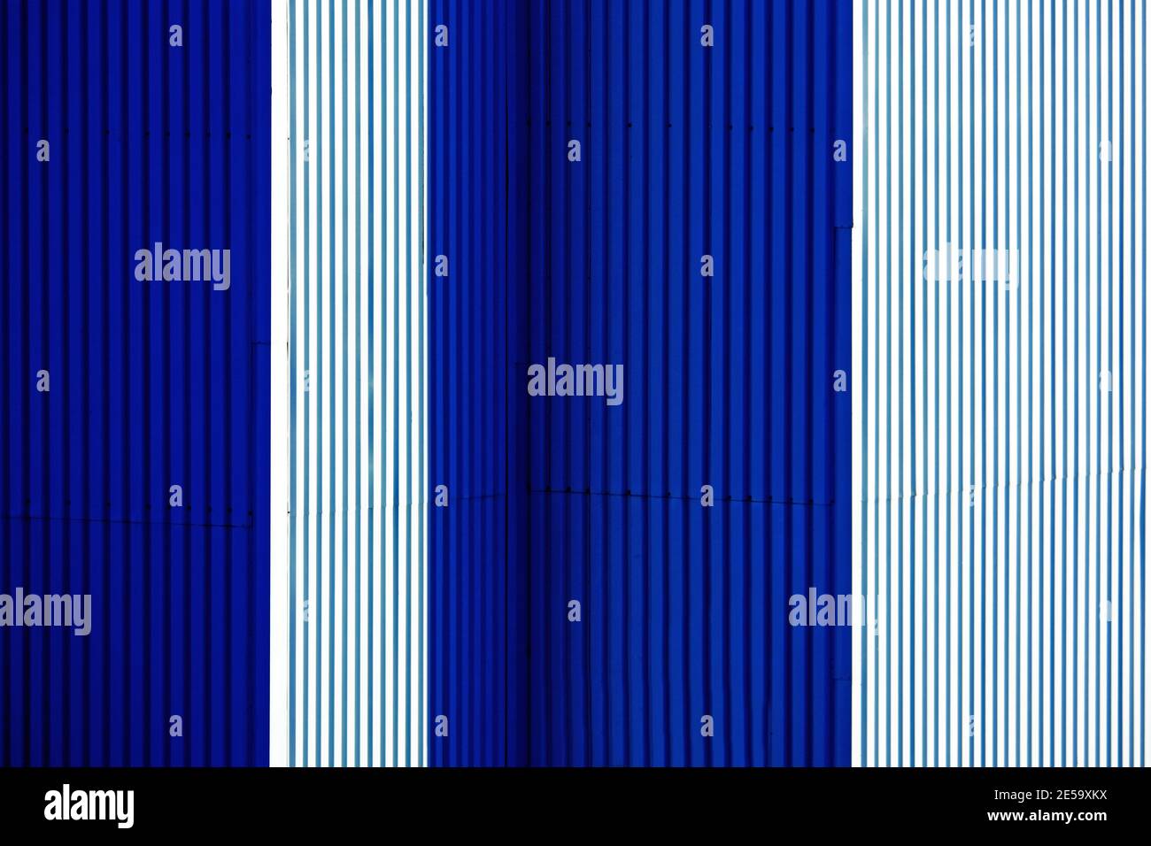Horizontal wide blue and white interposed corrugated metal wall panels