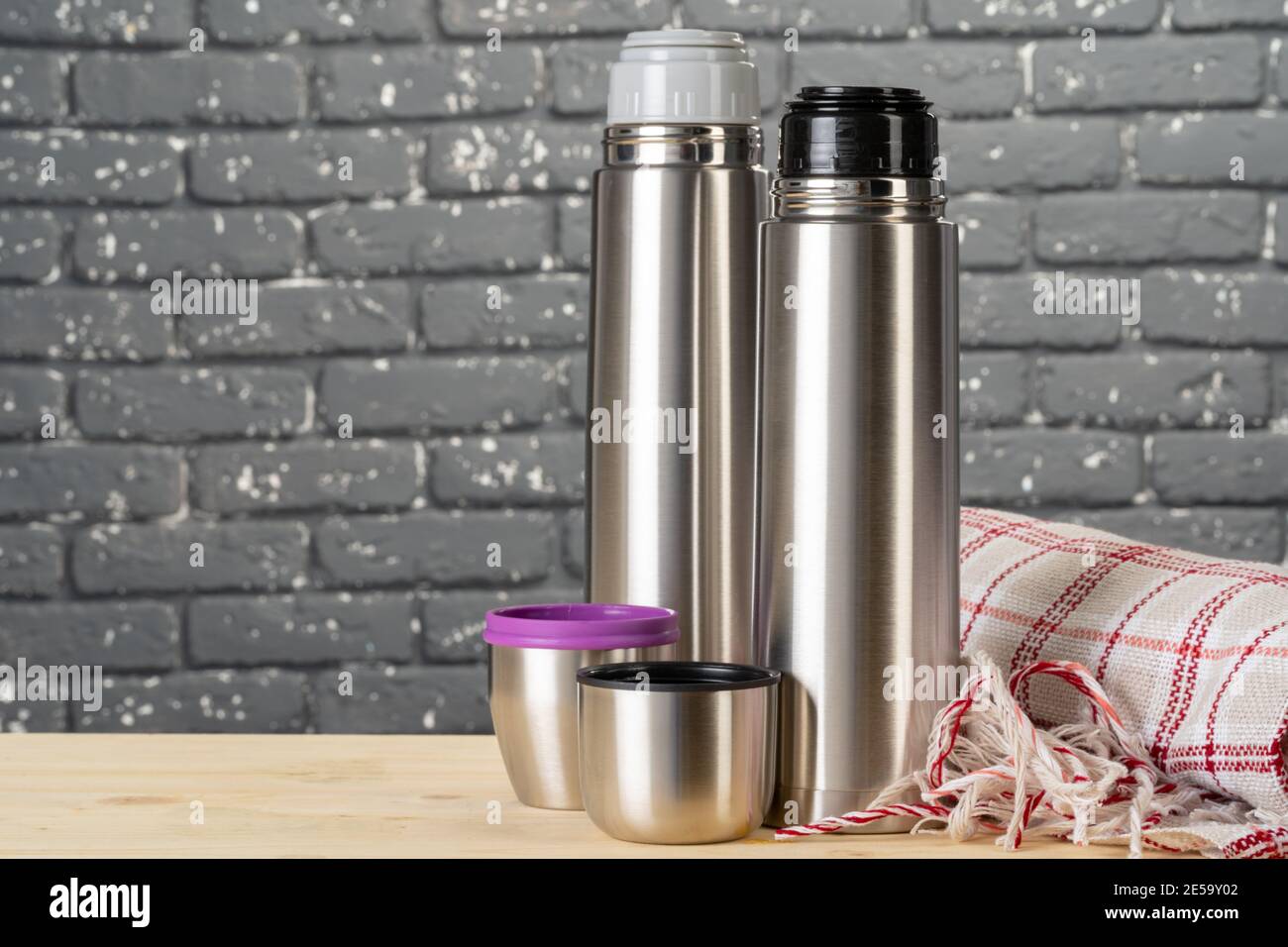 Aluminum metal thermos container bottle close up on table Stock Photo -  Alamy