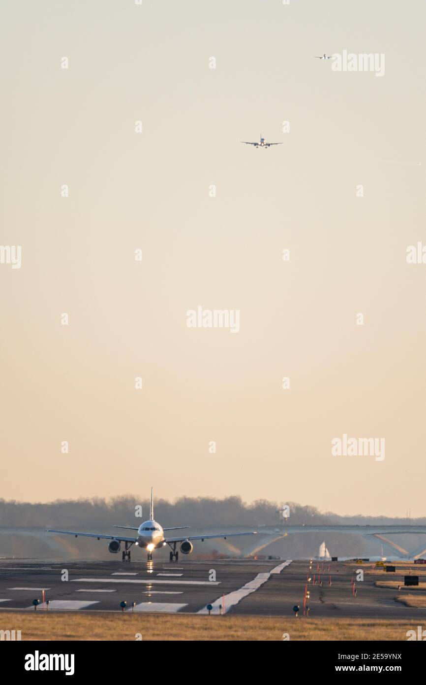 ARLINGTON, UNITED STATES - Jan 25, 2021: Arlington, Virginia USA- January 12th, 2020: A plane landing at DCA with two planes on approach in the backgr Stock Photo