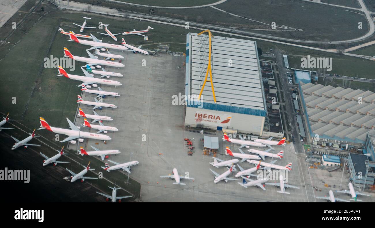Aerial view of multiple airplanes parked on tarmac at Madrid's Bajaras International Airport, Spain - total of 33 planes on tarmac Stock Photo