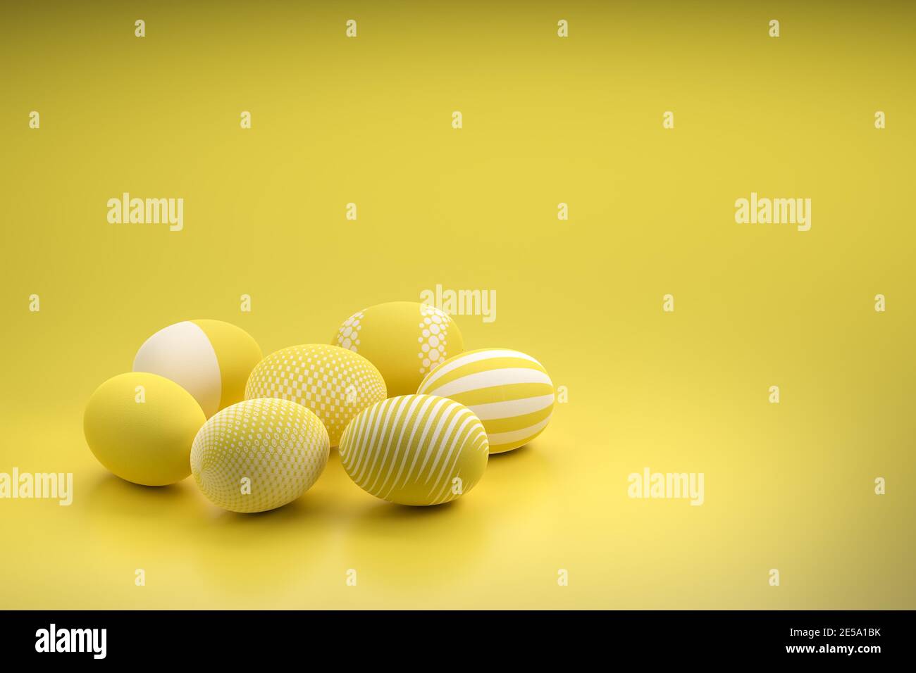 Easter Eggs with different textures in illuminated yellow color of the year on a seamless background Stock Photo