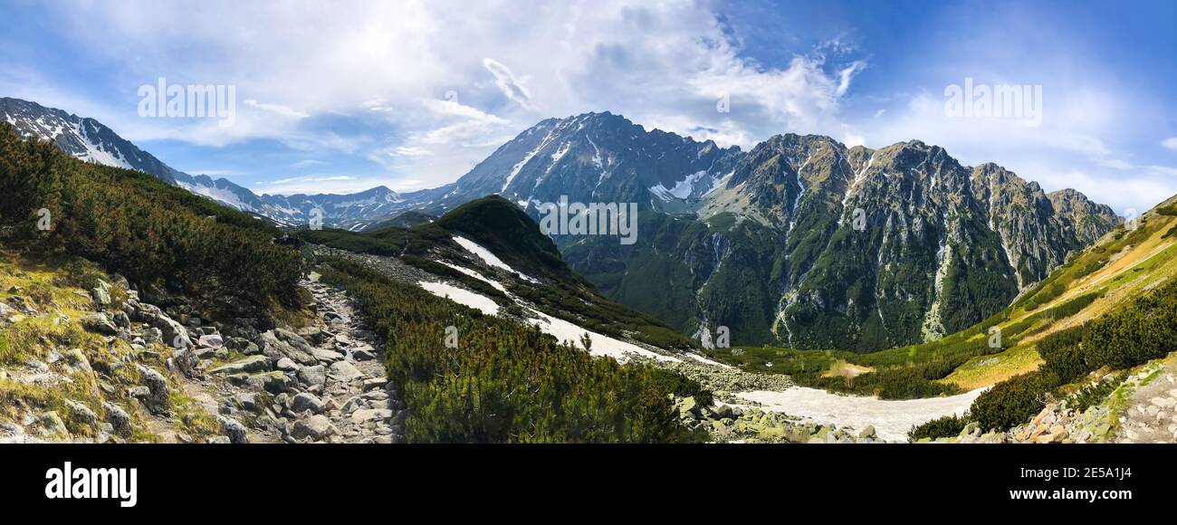 Scenic snow-covered valley with a mountainscape in the background, Tatra National Park in Poland Stock Photo