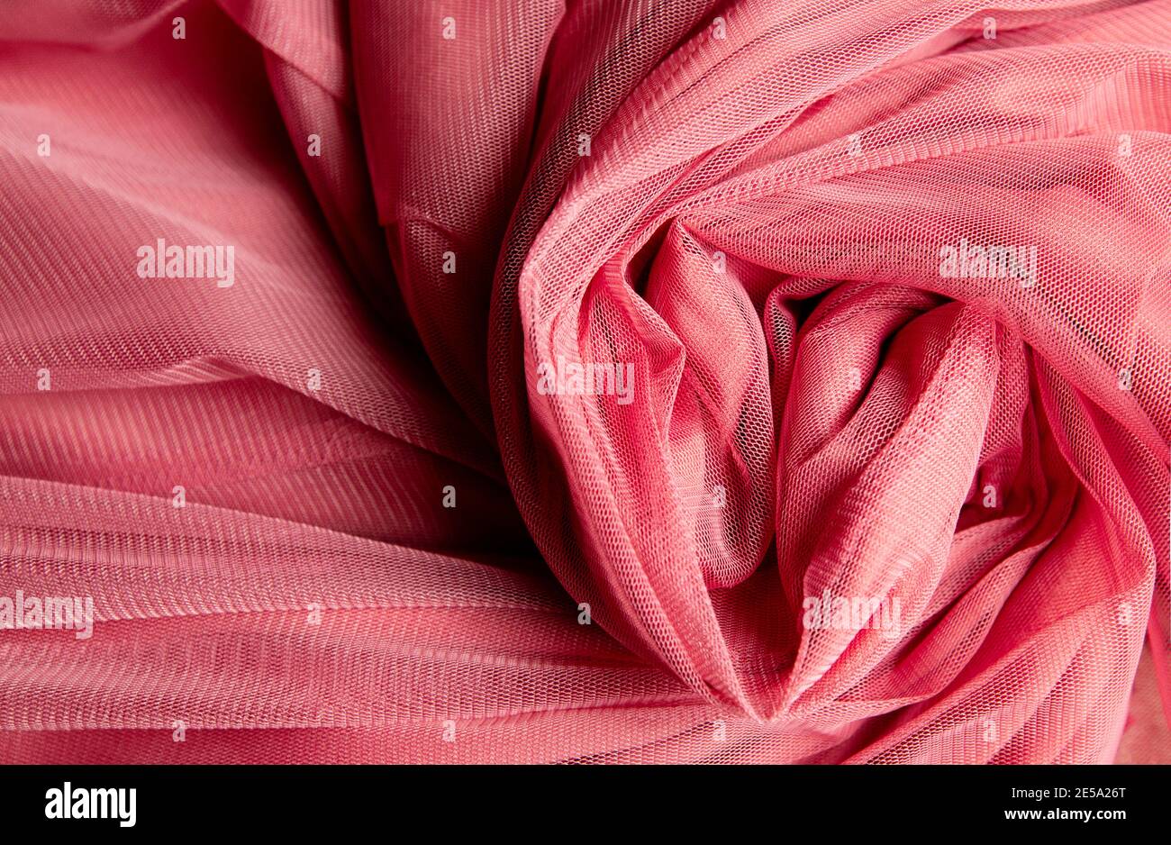 pink crumpled tulle fabric. fabric background Stock Photo