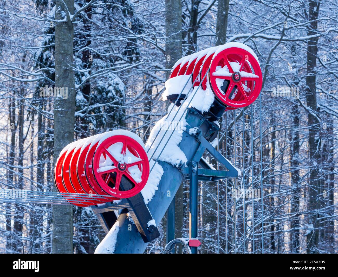 Empty early morning wheeled pullers Red wheels detail in Platak Radesevo ski resort in Croatia Europe Stock Photo