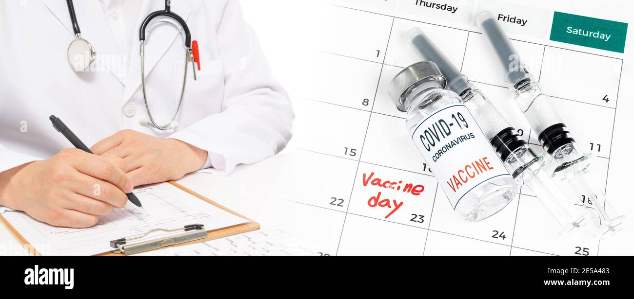 Calendar with a date of vaccination with a doctor filling out the medical chart. Stock Photo