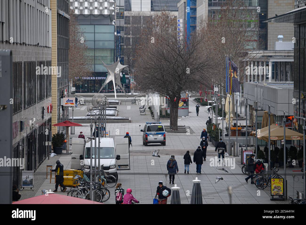 Dresden, Germany. 27th Jan, 2021. A police car drives along the shopping mile Prager Straße to control the Corona protection ordinances. Credit: Robert Michael/dpa-Zentralbild/dpa/Alamy Live News Stock Photo