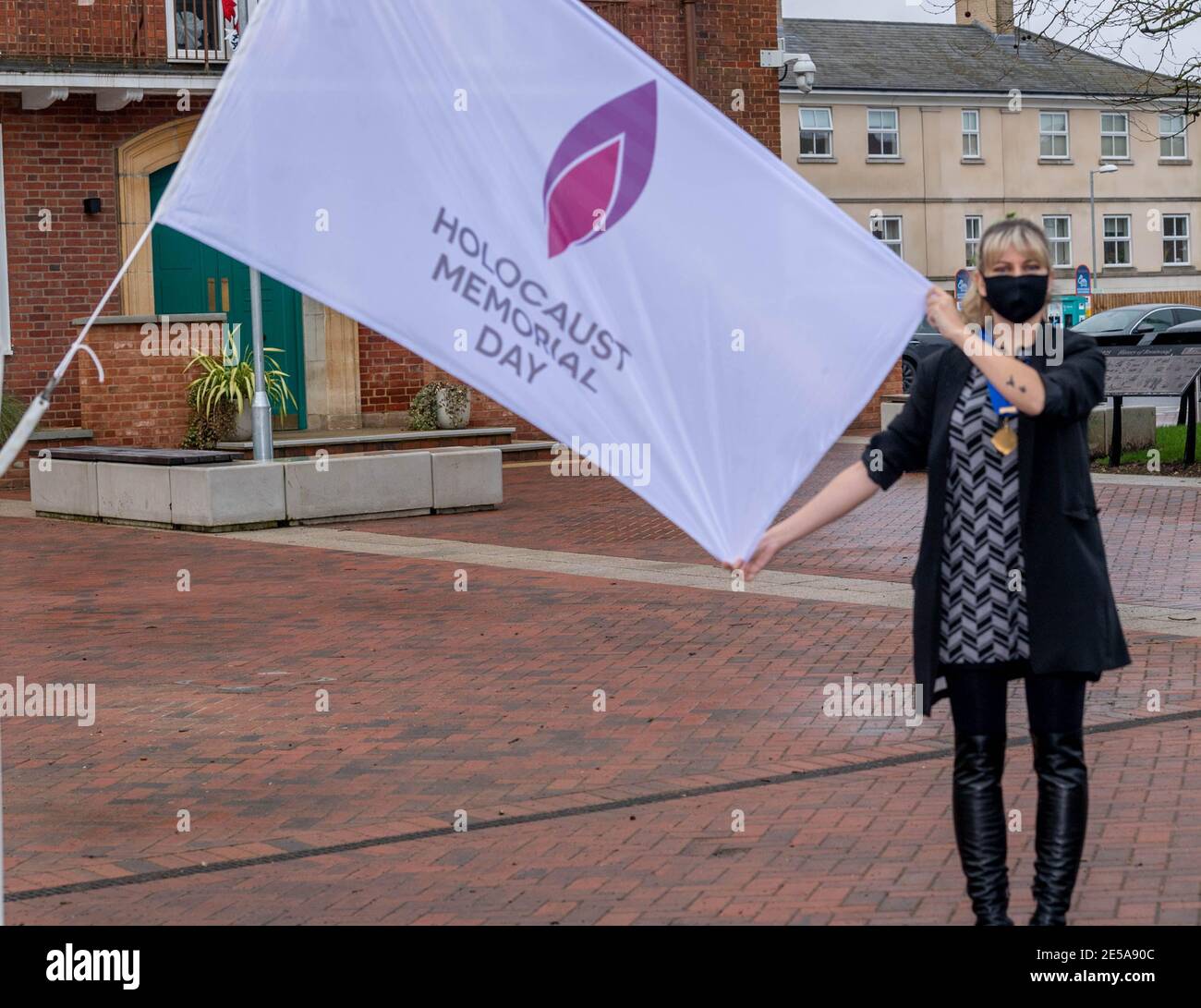 Brentwood Essex 27th January 2021 Holocaust Memorial Day is marked by the raising of the Memorial flag to half mast outside Brentwood Town Hall, Brentwood, Essex by Brentwood Brough Council Deputy Mayor Ms Olivia Sanders Credit: Ian Davidson/Alamy Live News Stock Photo