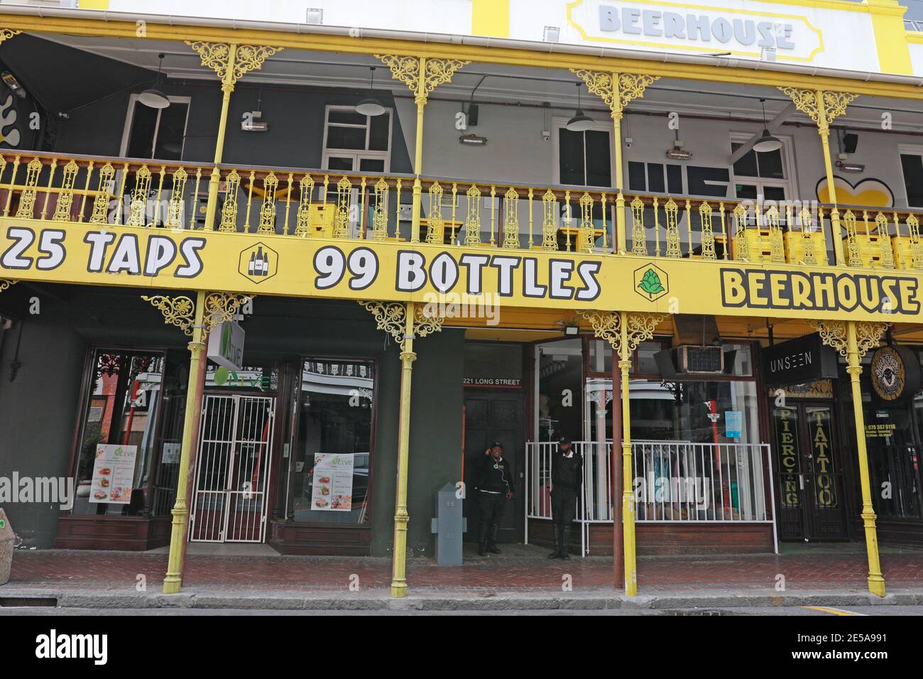Security guards on duty during pandemic in front of Beerhouse in Long  Street, Cape Town, South Africa Stock Photo - Alamy