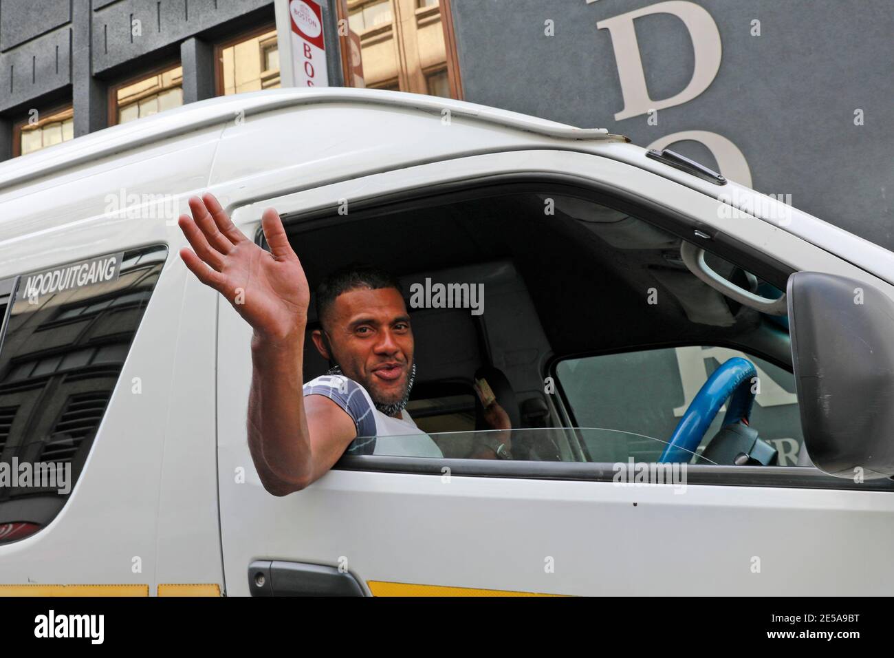 Cape Town taxi driver waving , Long Street, Cape Town, South Africa. Stock Photo