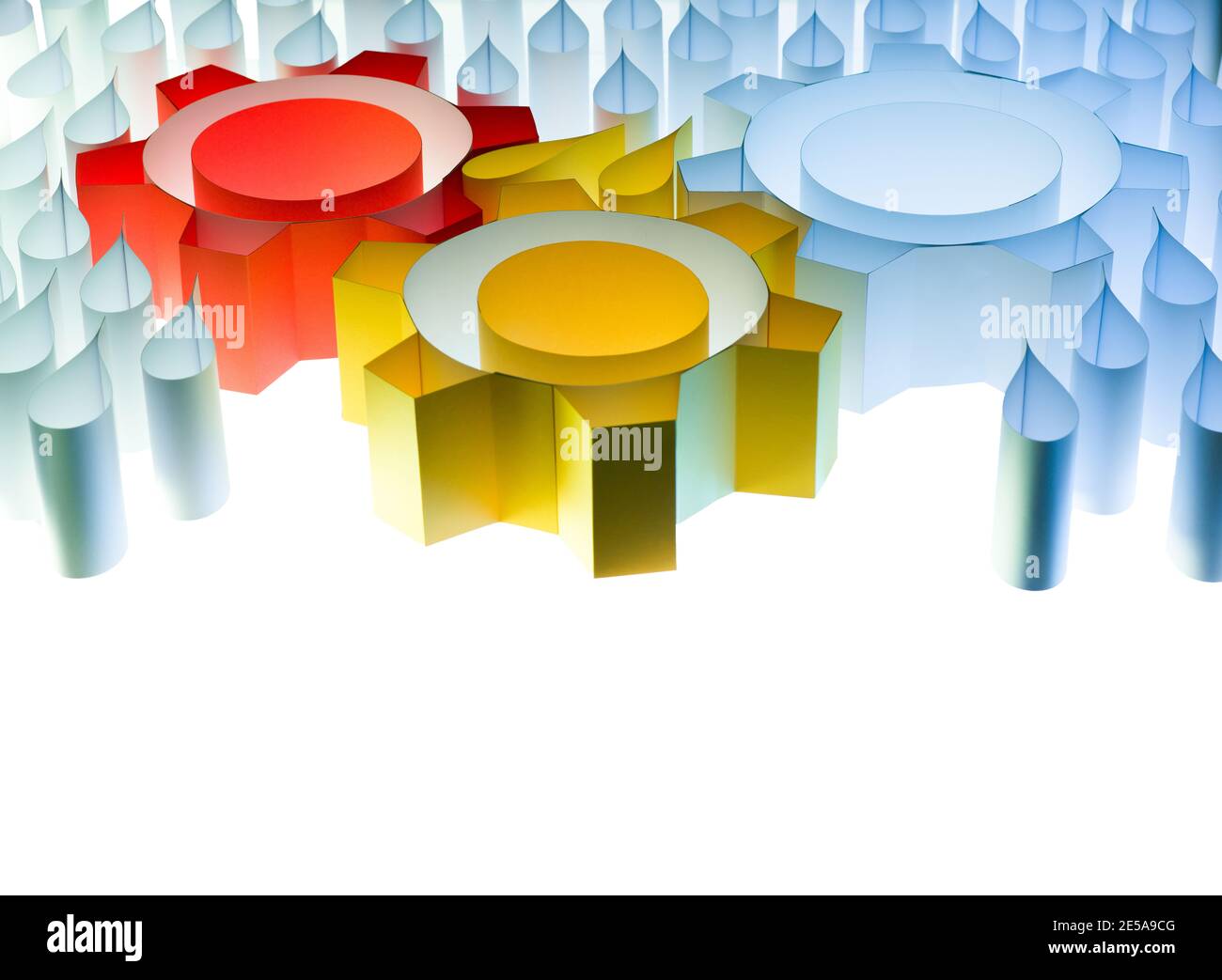 Lubricated gears concept made from paper on white background. Colorful wheels with copy space. Stock Photo