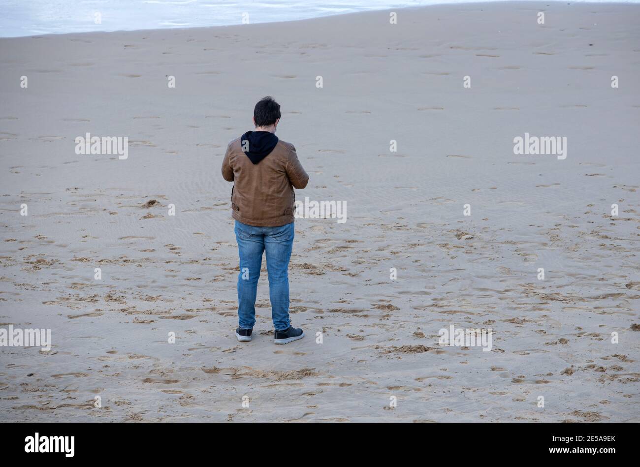 man stand on the beach sand Stock Photo
