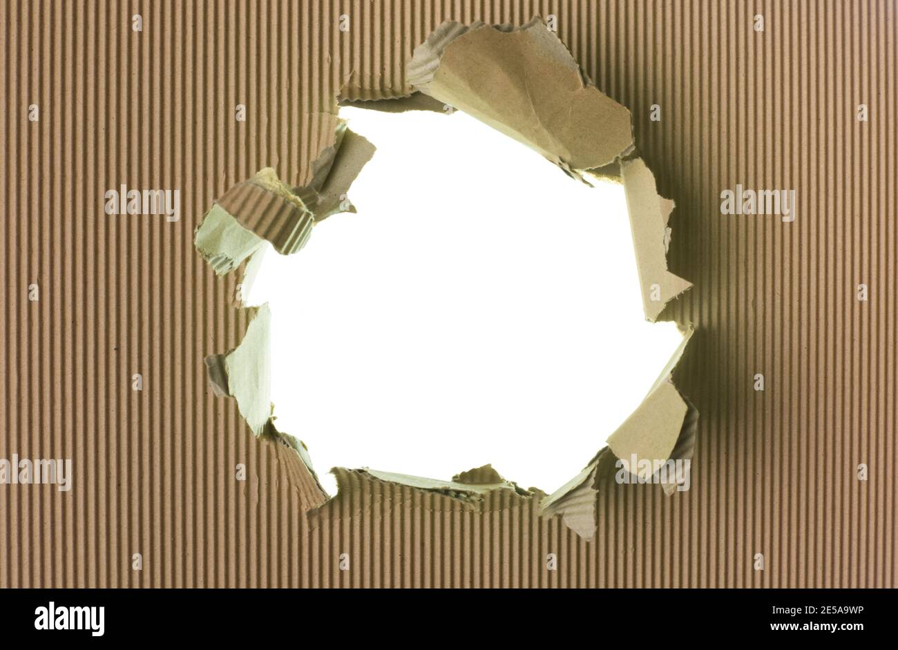 Ripped brown paper background, big hole Stock Photo
