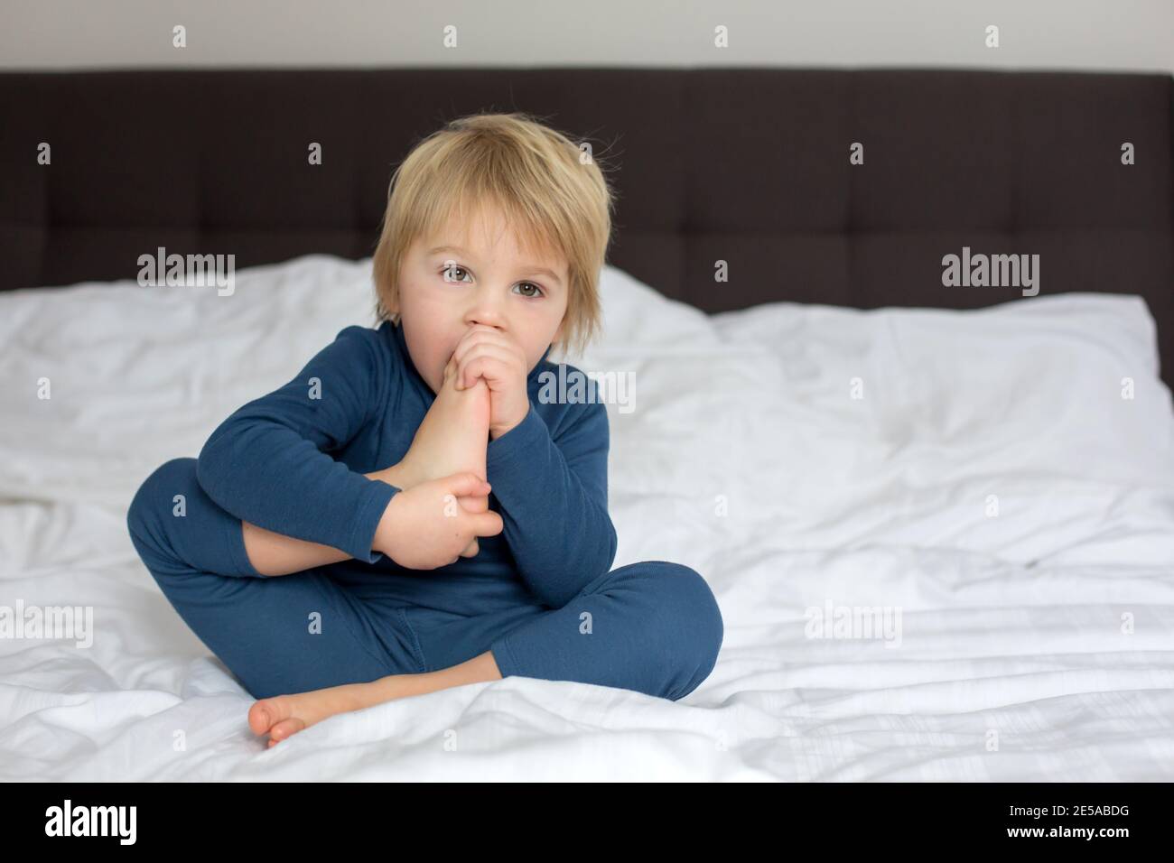 Child sucking foot hi-res stock photography and images - Alamy
