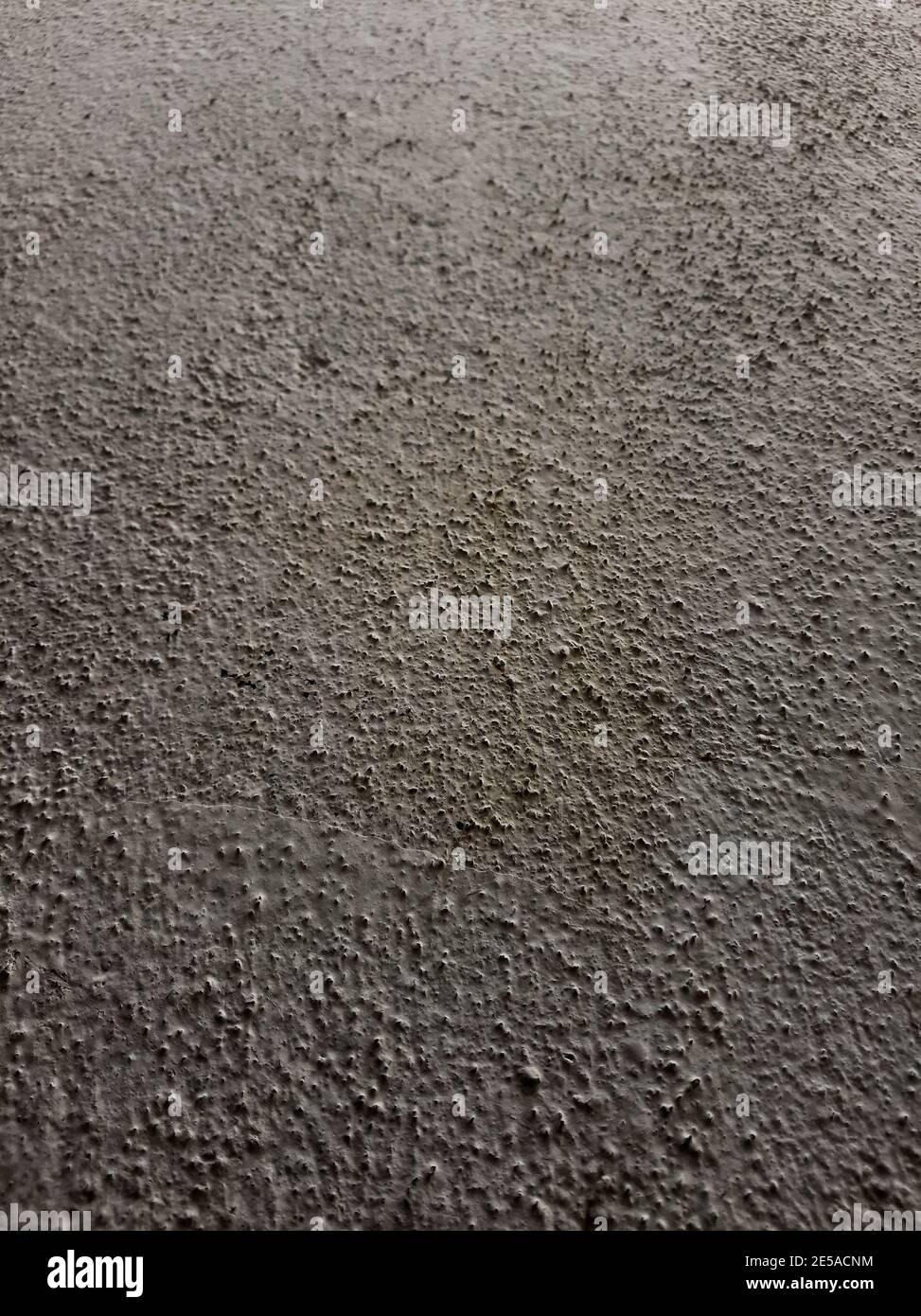 A vertical shot of a cemented wall texture Stock Photo
