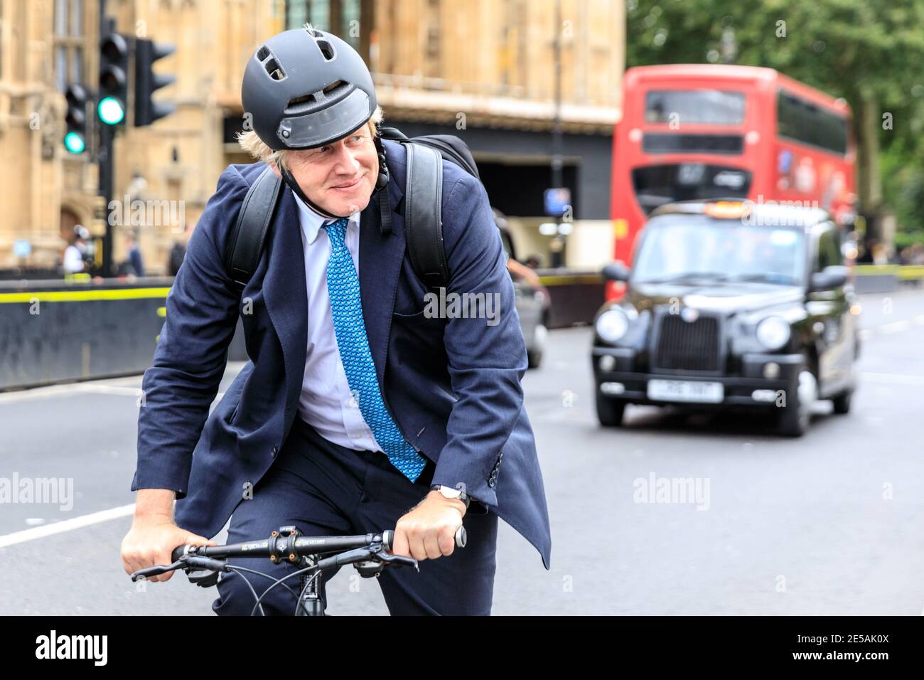 Boris Johnson MP, British Conservative Party politician, riding his bicycle at Parliament in Westminster, London, UK Stock Photo