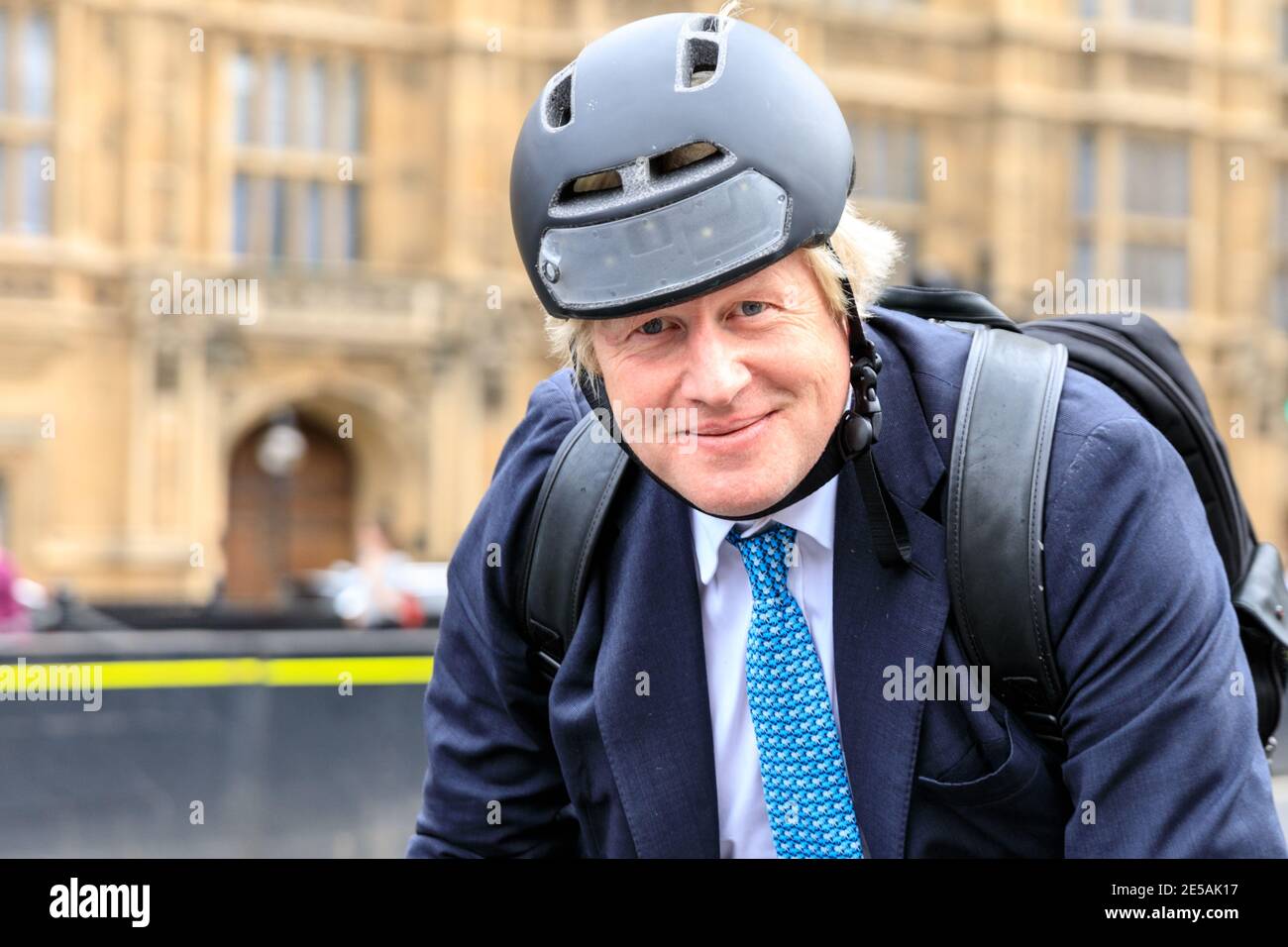Boris Johnson MP, British Conservative Party politician, riding his bicycle at Parliament in Westminster, London, UK Stock Photo