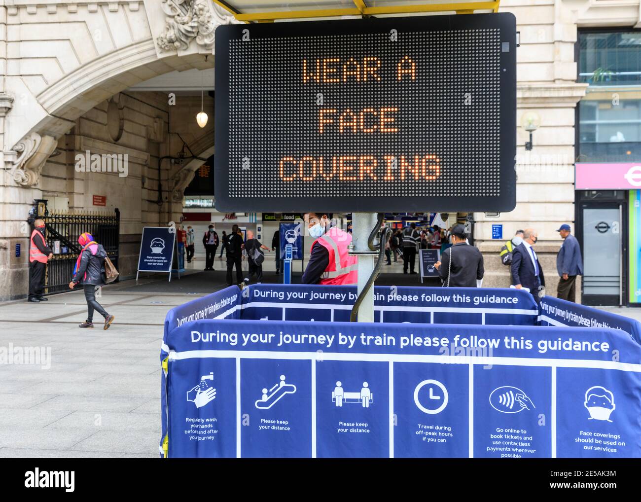 Covid pandemic warning sign to wear face covering or mask on public