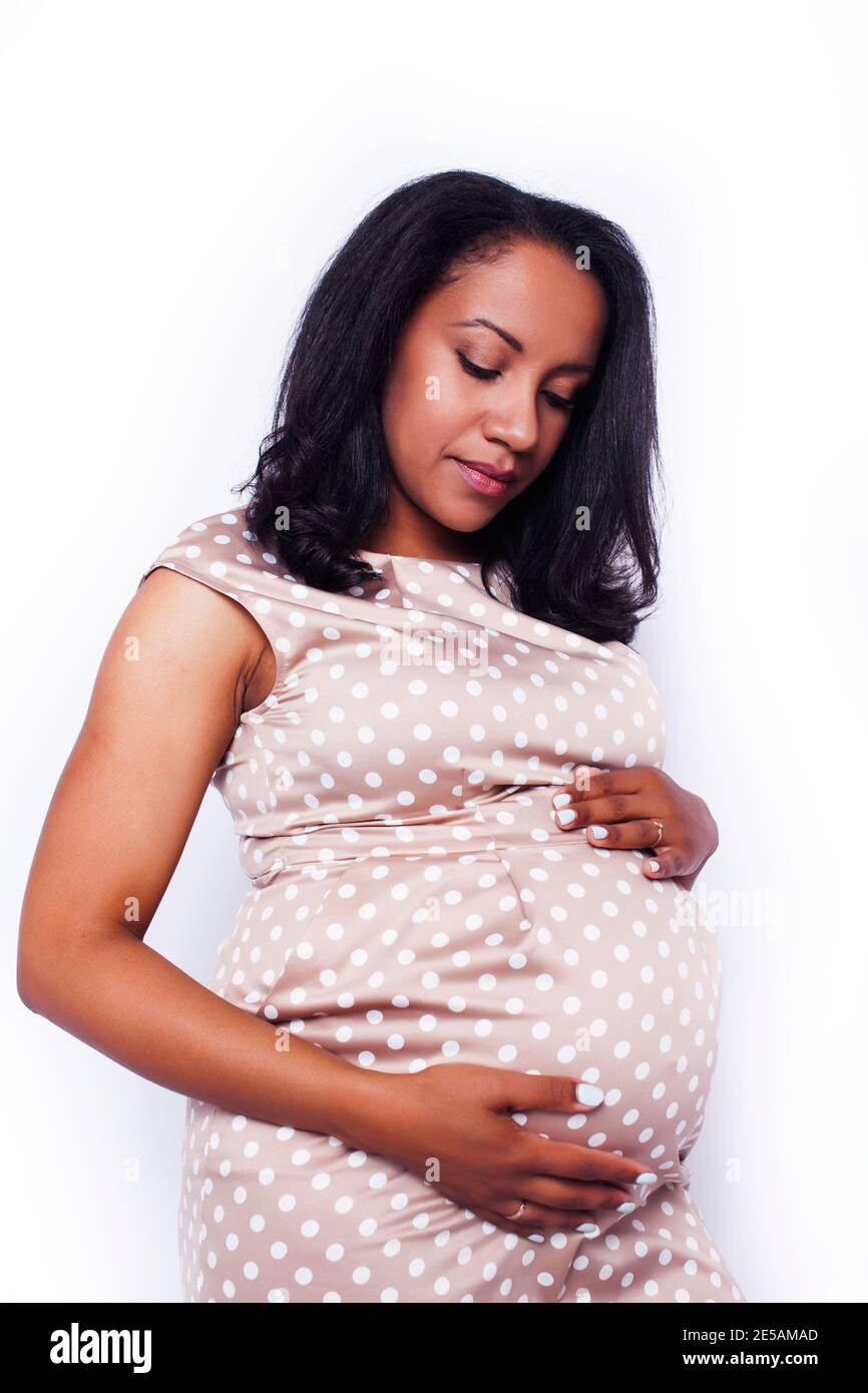 Beautiful young pregnant african american hi-res stock photography