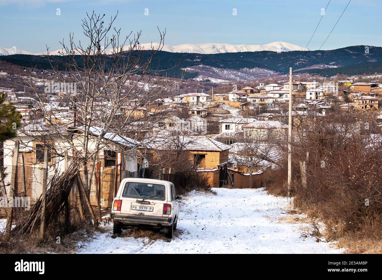 View of the snow capped Stara Planina mountain range over a village in Bulgaria Stock Photo