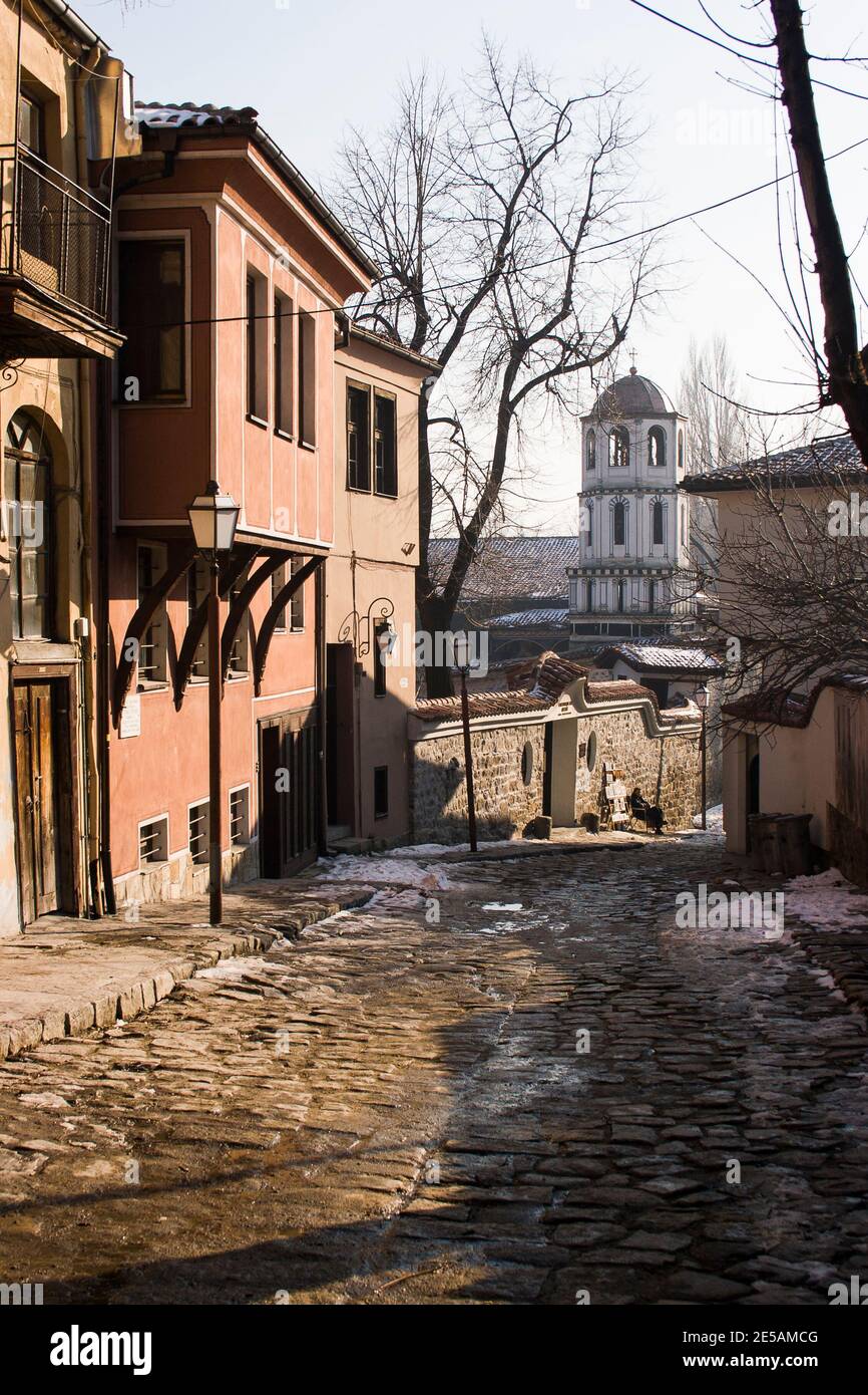 Classic examples of revival houses in the UNESCO world heritage site of  old town in Plovdiv with the old church of Konstantin and Elena in background Stock Photo