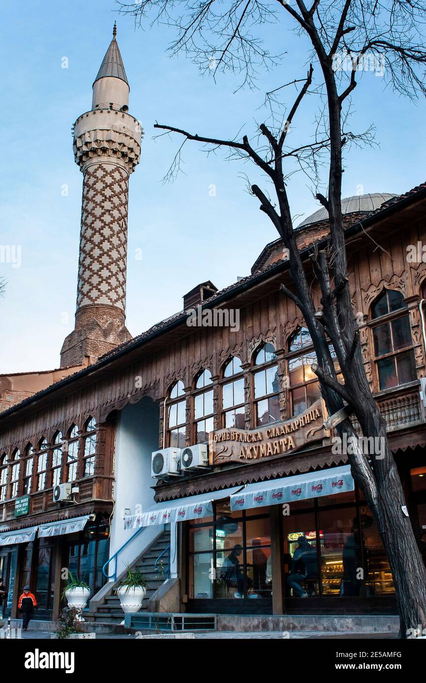 Dzhumaya mosque minaret visible above a turkish coffee shop in Plovdiv., Bulgaria Stock Photo