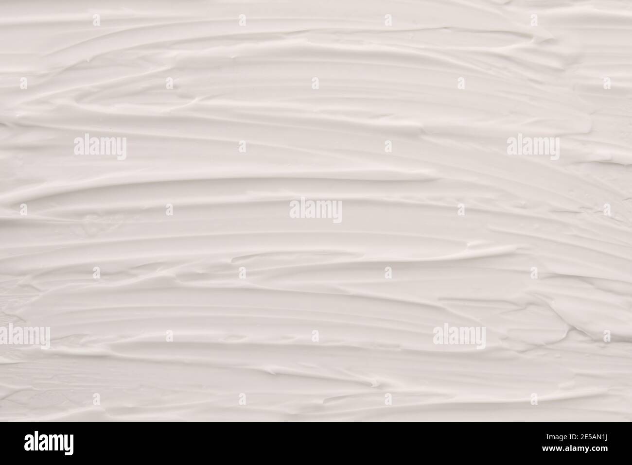 White cosmetic skin cream texture background dragging. Horizontal