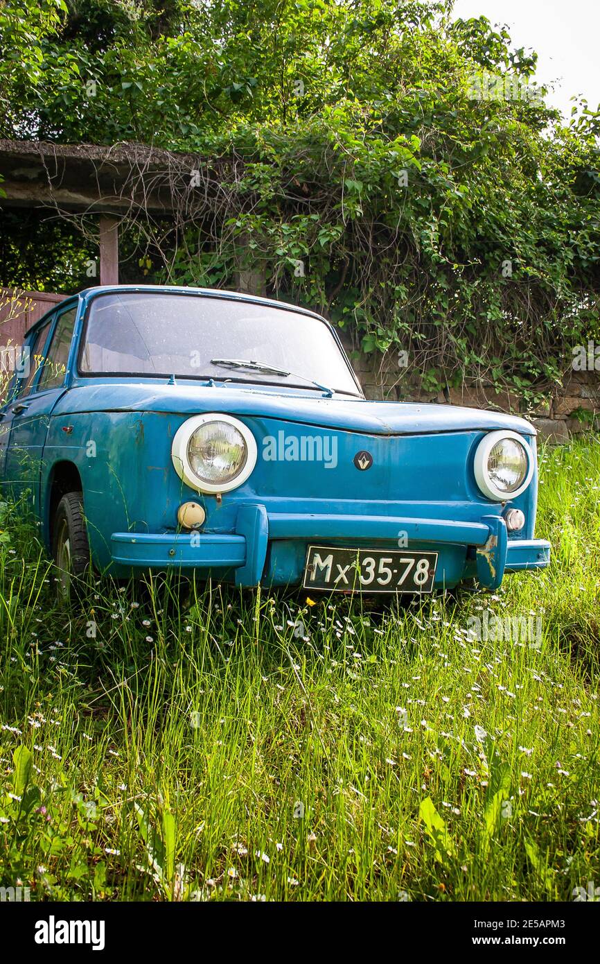 Old retro Renault 8 car parked in a meadow in Bulgaria Stock Photo