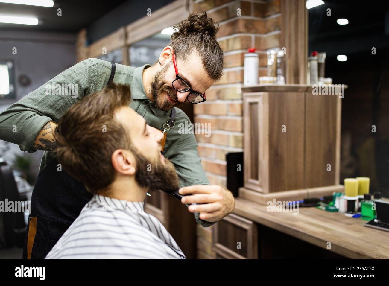 Client during beard and moustache grooming in barber shop Stock Photo Alamy
