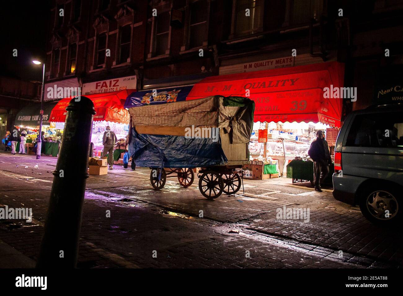 Traditional market trader's wheeled market cart at night in Brixton market at closing time, London Stock Photo