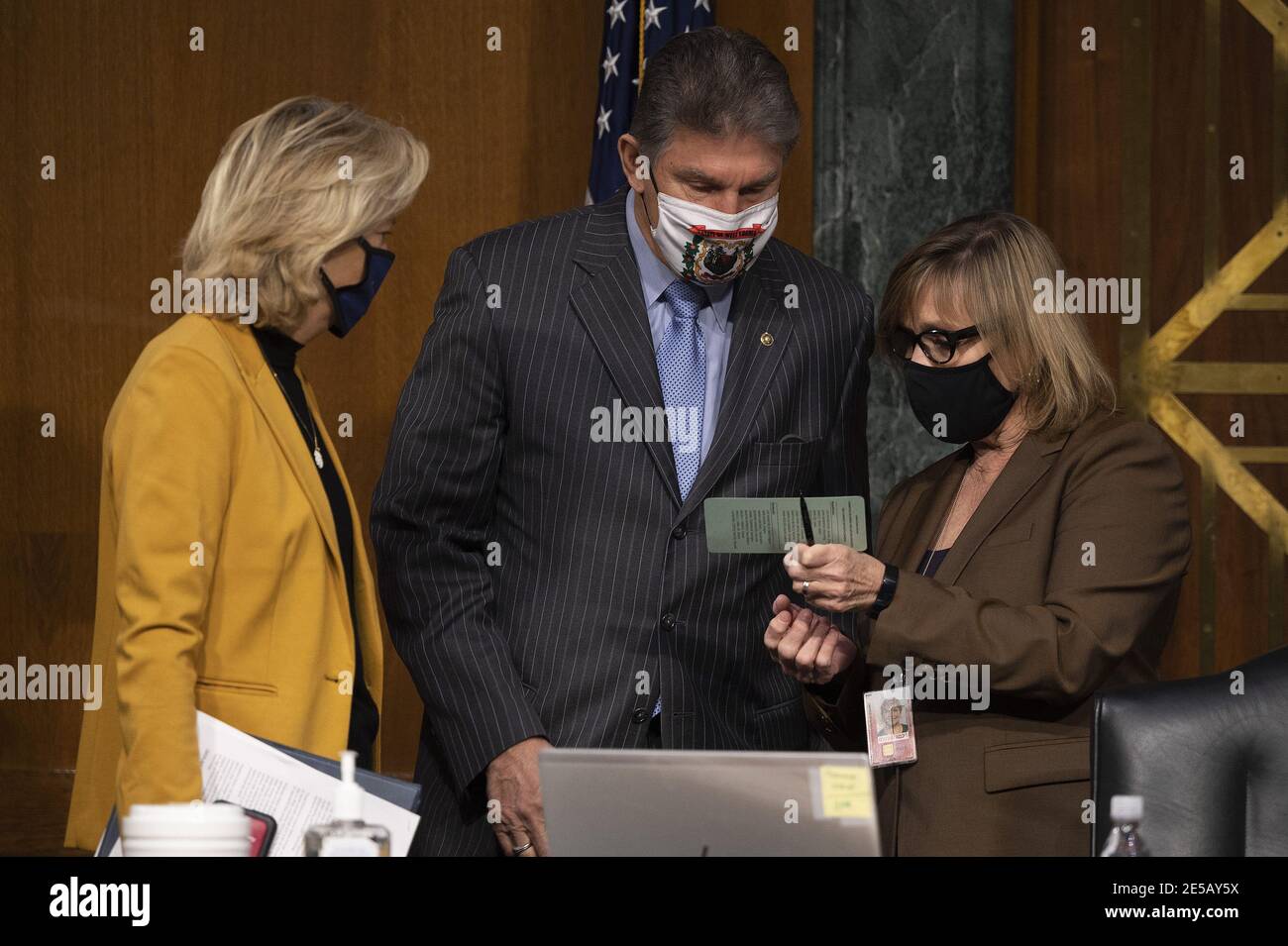 Washington, United States. 27th Jan, 2021. Chairwoman Lisa Murkowski (L), R-Alaksa, and Ranking Member Joe Manchin, D-WV, go over a seating chart as control of the committee had not been finalized ahead of a hearing to examine the nomination of Former Michigan Governor Jennifer Granholm to be Secretary of Energy, on Capitol Hill in Washington, DC, on January 27, 2021. Photo by Jim Watson/UPI Credit: UPI/Alamy Live News Stock Photo