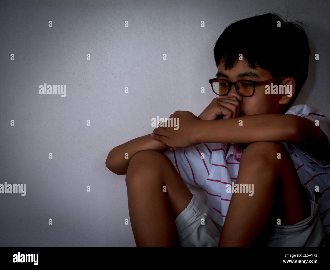 Neglected Face Neglected Lonely Child Leaning At Room corner with sadness and unhappy ...