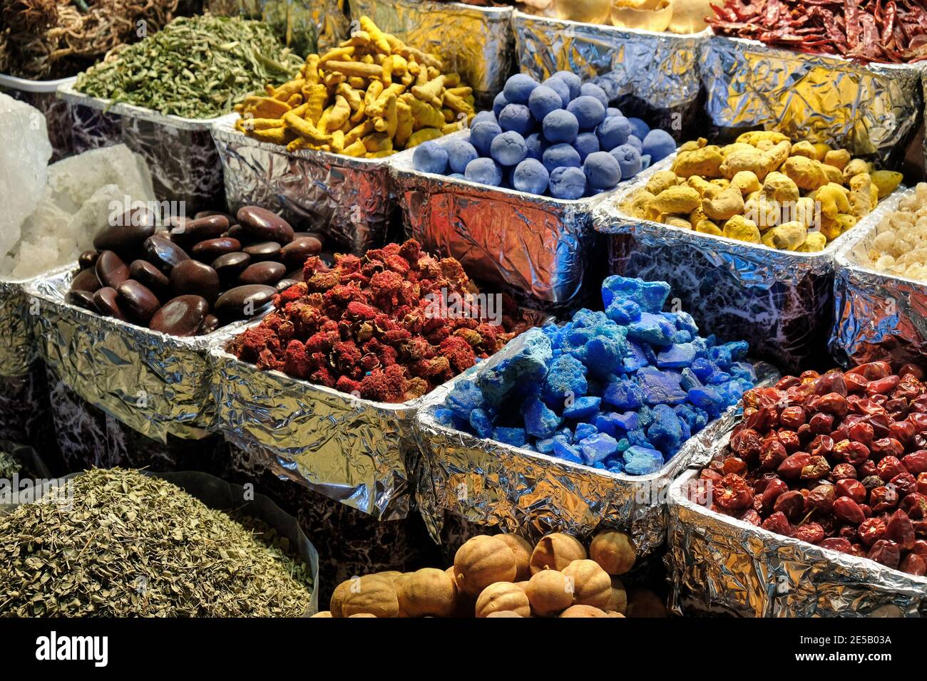 Herbs, spices, dried fruits, menthol crystals, blue dye at the old market in Dubai, United Arab Emirates. Stock Photo