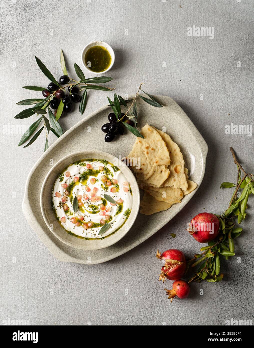 iranian or arabian dish, yogurt labneh goats milk dip with taftan bread