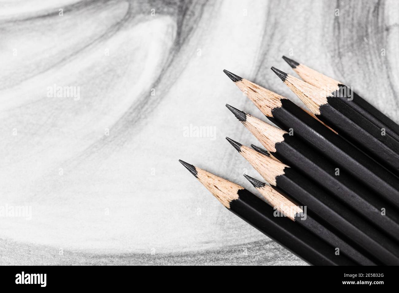 top view of set of black graphite pencils on hand-drawn academic