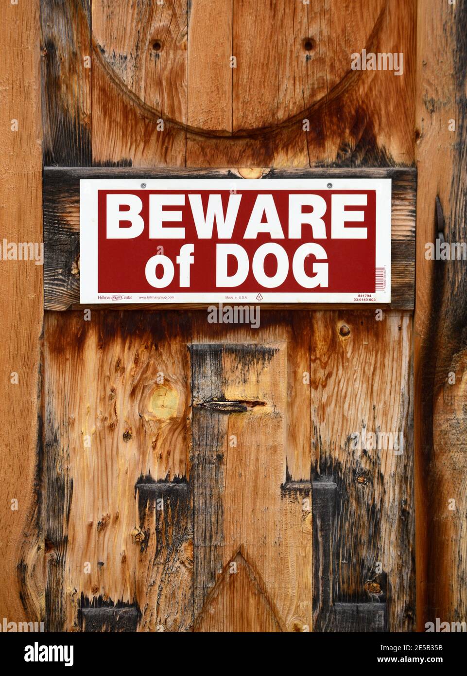 A Beware of Dog sign on a fence in Santa Fe, New Mexico. Stock Photo