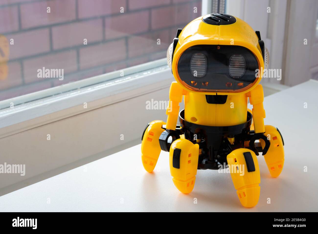 A child's toy, a yellow robot. image isolated on a white background