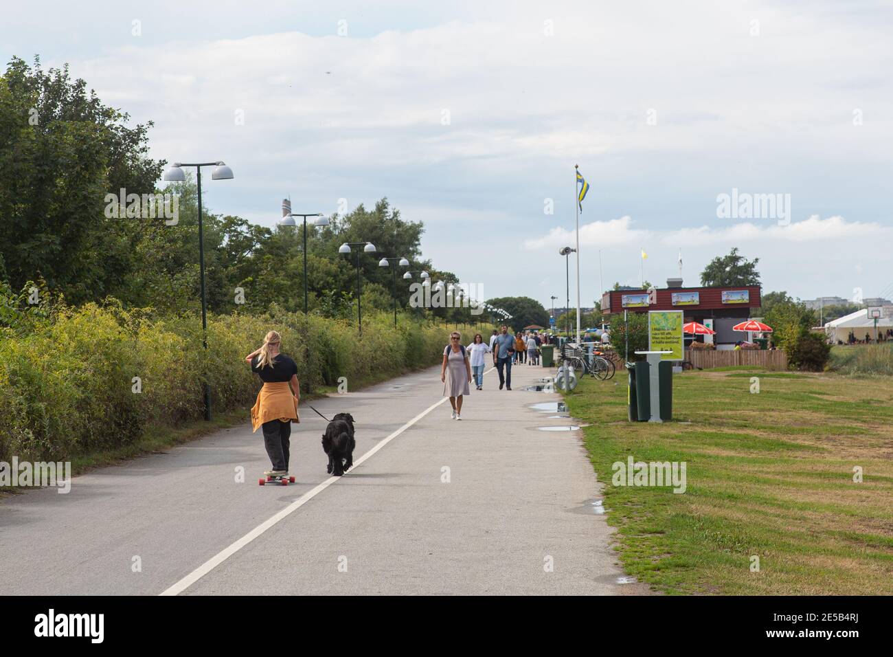 People out walking in a park on a early afternoon in south Sweden Stock Photo