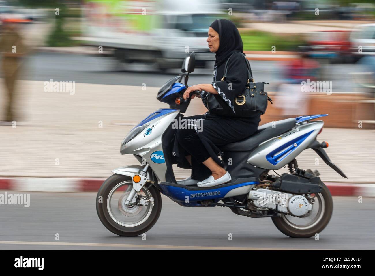 Arab woman on scooter Stock Photo