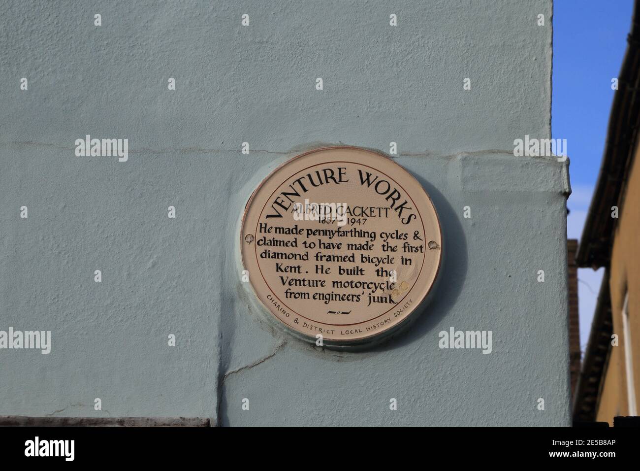 Plaque for Venture Works on side of house in High Street, Charing, Kent