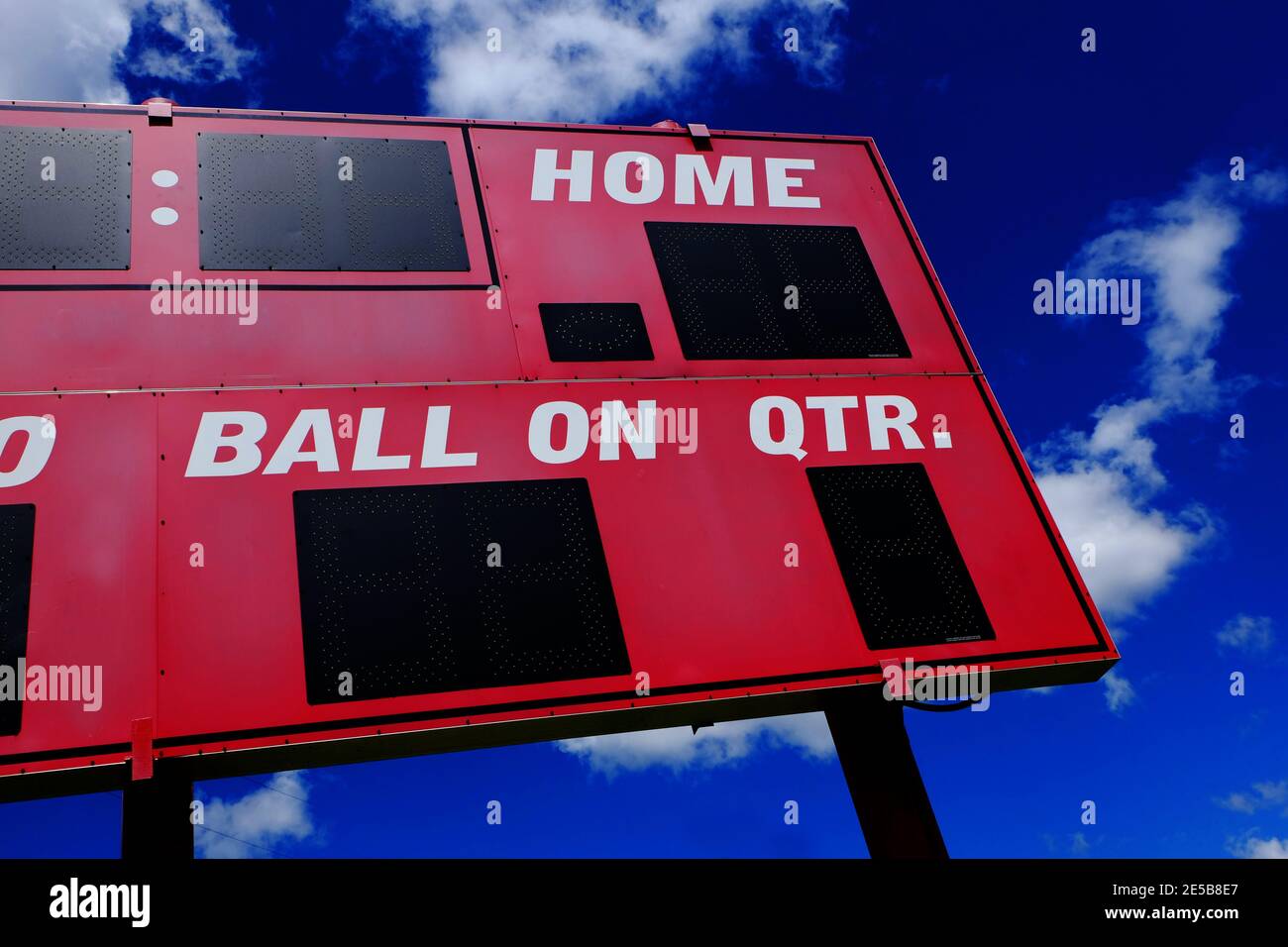 Baseball scoreboard red competition with blue sky and clouds Stock