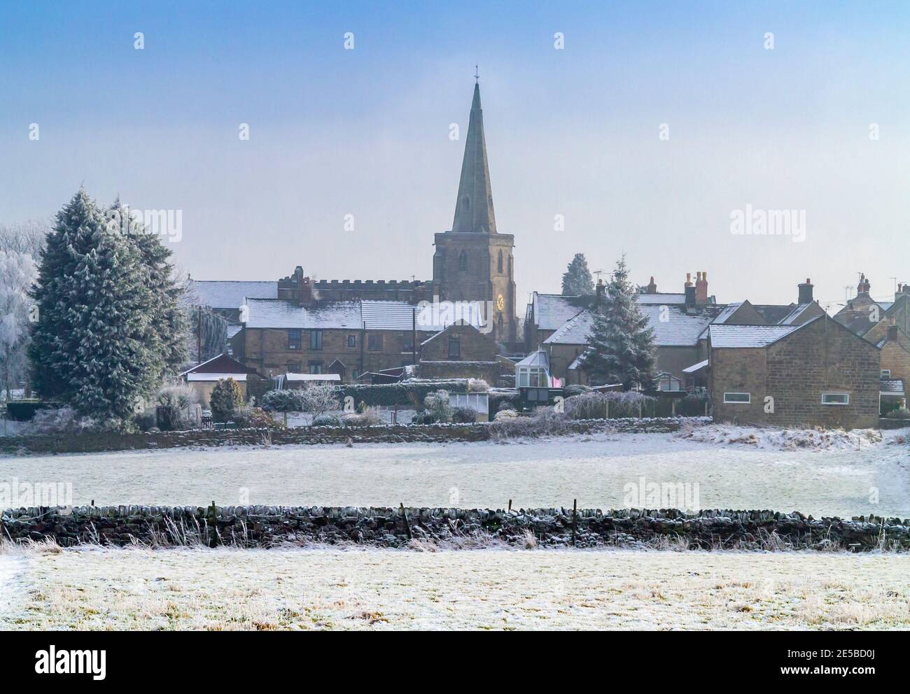 Winter view with frost covered trees and snow at Crich village in the Amber Valley area of the Derbyshire Peak District England UK Stock Photo