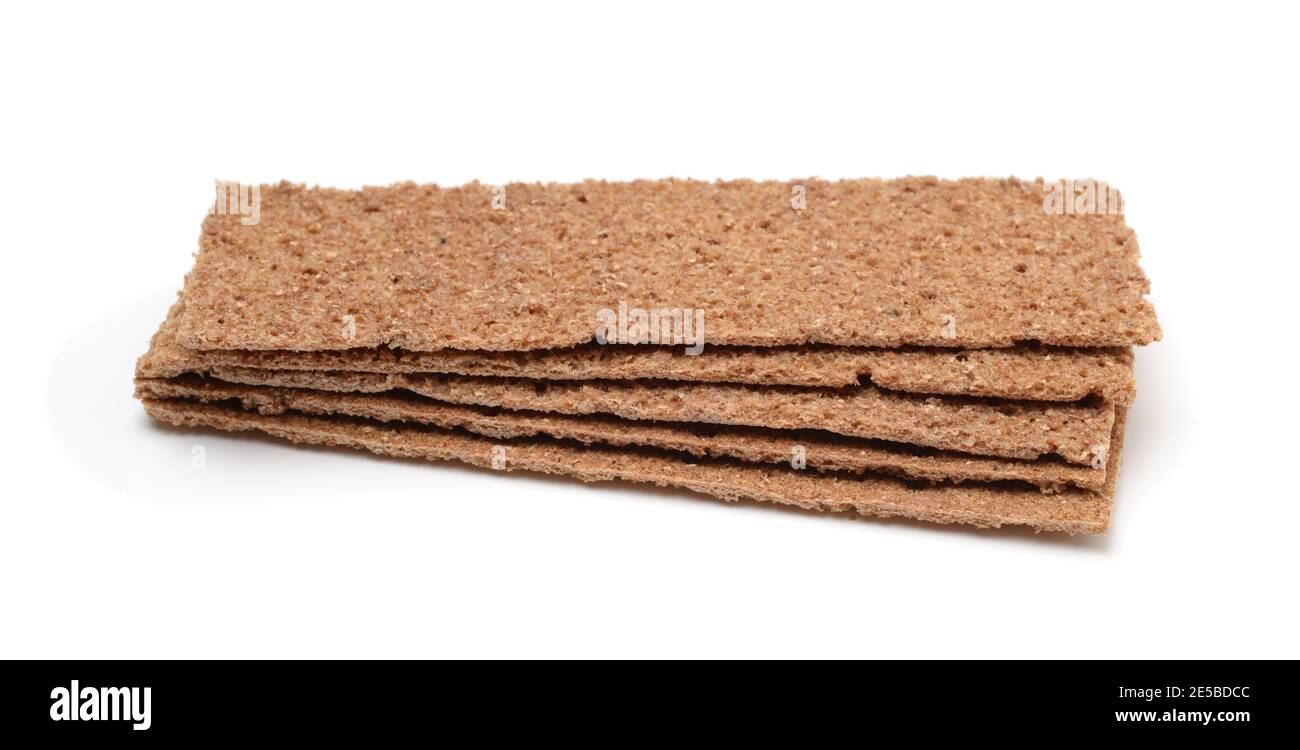 Stack of thin rye crispbread isolated on white. Side view. Stock Photo