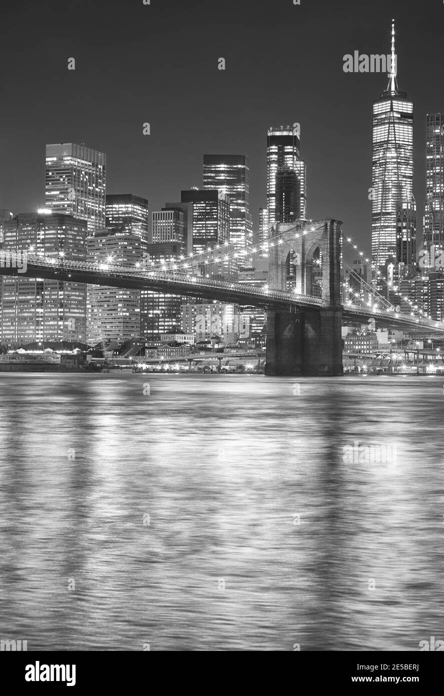 Black and white picture of Brooklyn Bridge at night, New York City, USA. Stock Photo