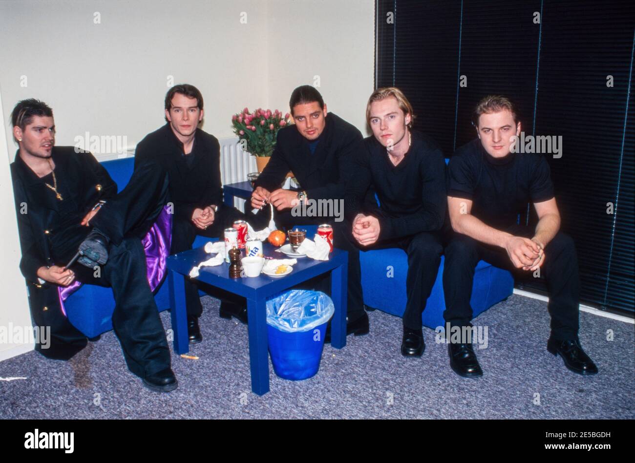 AMSTERDAM, NETHERLANDS - MAY 26, 1998: Boyzone was an Irish boyband with leadsinger Ronan Keating. Here they are waiting in a dressing room. Stock Photo