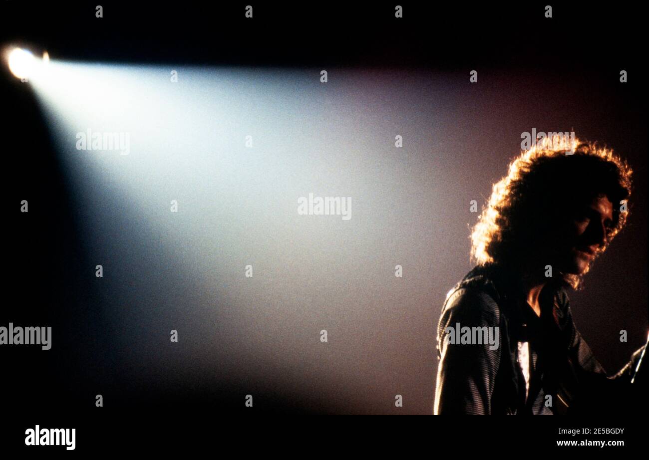 LEIDEN, THE NETHERLANDS - NOV 27, 1980: Brian May guitarist of the british band Queen during a concert in the Groenoordhallen Stock Photo