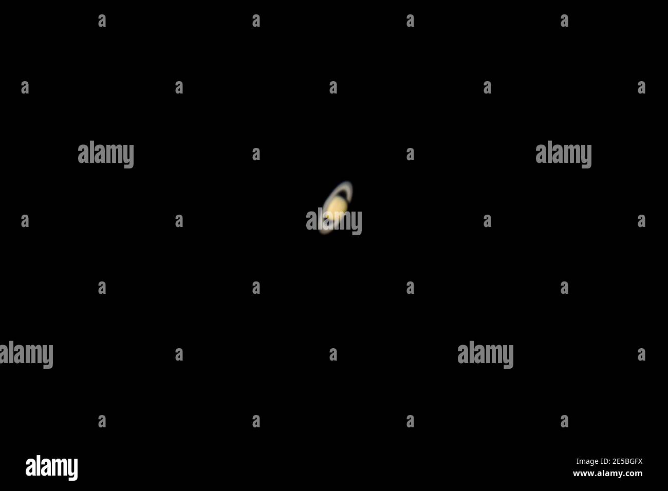 Planet Saturn and its rings as seen from an advanced amateur telescope from a city sky at Santiago de Chile. Saturn, the Giant Gas Planet show us its Stock Photo