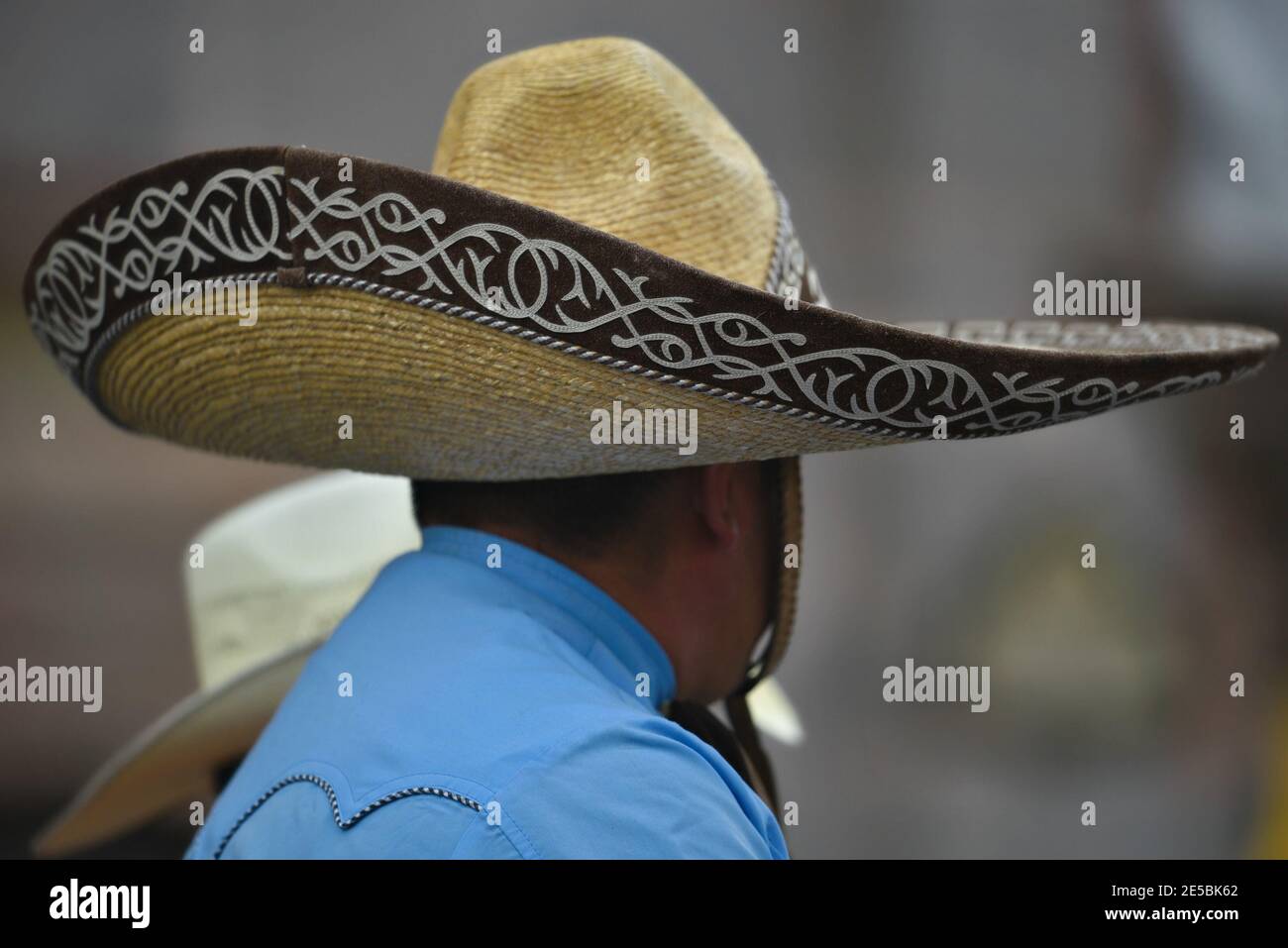 Local man wearing an authentic Mexican straw sombrero hat in the historic center of San Miguel de Allende, Guanajuato Mexico. Stock Photo
